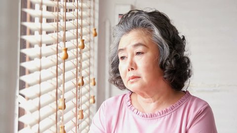 Asian senior woman with sad emotion.