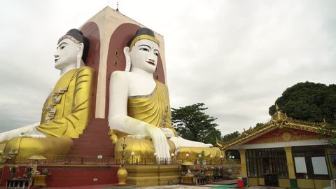 Four Faces of Buddha at Kyaikpun Buddha, in Bago, Myanmar, in the rainy season