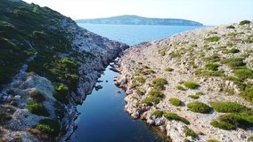 Aerial drone bird's eye view video of tropical rocky small safe bay of Mogonisi, Paxos island, Ionian, Greece