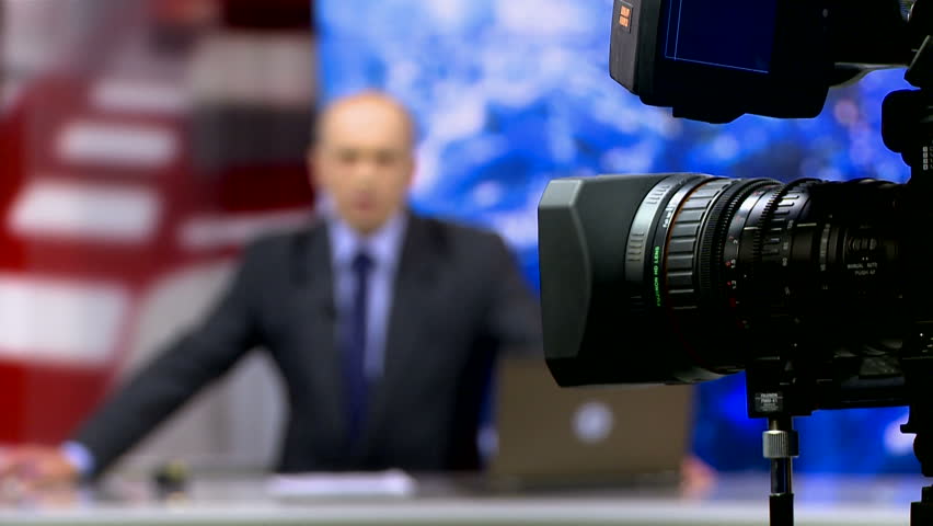 Backstage shooting news in a television studio. News presenter. Royalty-Free Stock Footage #1016311231