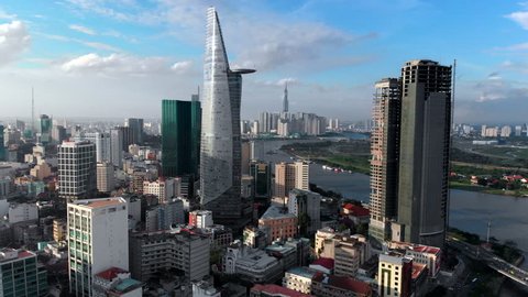 Aerial view of Downtown district of Ho Chi Minh City, aka Saigon, including architectural landmark Bitexco Financial Tower during daytime, South Vietnam.