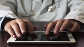 Doctor Male Using Digital Tablet. Close Up - Powered by Shutterstock - Get 15% off with code: PIKWIZARD15