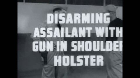 CIRCA 1942 - US Navy sailors demonstrate how to disarm an assailant with a gun in a shoulder holster.