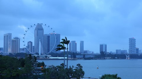 SINGAPORE, SINGAPORE - APRIL 12, 2011 Establishing Shot Time Lapse Aerial View of Singapore City Skyline Dusk to Night