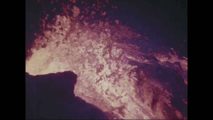 CIRCA 1973 - Lava flows through the Pauahi Crater at nighttime.