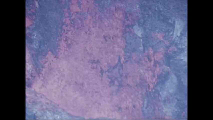 CIRCA 1973 - Lava froths and flows (mostly in close-up) at the Pauahi Crater.
