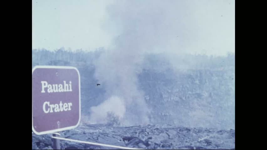 CIRCA 1973 - After the Pauahi Crater erupts, smoke can be seen billowing out of it from the road.