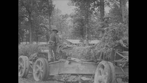 CIRCA 1910s - 60th Coast Artillery troops use tractors to pull French 155 mm guns from the mud at Ribeullean in World War 1.