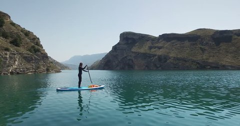 Woman Exploring Sulak Canyon by SUP Board, Dagestan, Russia.

