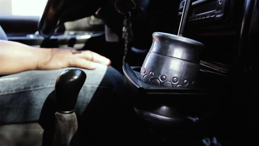 Man Driving Old Car, Yerba Mate Gourd in Cup Holder, Shifting Gears, Buenos Aires, Argentina