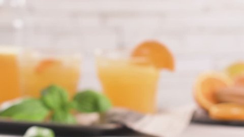 Fresh organic orange juice. Homemade citrus orange juice in glasses on table.