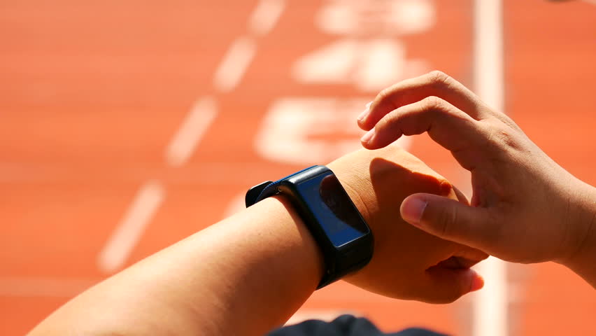 Coaches use the stopwatch Keep Athletes running statistics During  Athletes are running into the finish line at the stadium for the competition and physical fitness test in sport and reaction concept Royalty-Free Stock Footage #1016383840