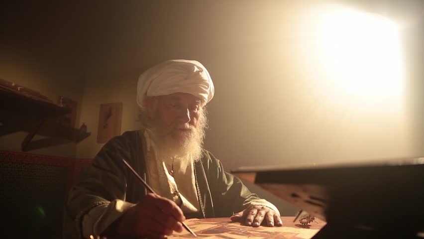 Old islamic muslim scientist working in madrasah room. Old tools, reed pen, ink pot, papirus drawings and book of quran some scenes in dark and foggy enviroment.  Royalty-Free Stock Footage #1016384647