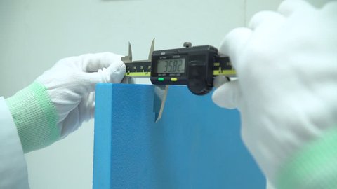 Scientist is using  accurate Vernier Caliper equipment to measurement object in innovation research laboratory.