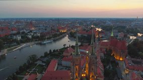 Aerial: Cathedral Island in Wroclaw, Poland. Wroclaw View at Tumski island and Cathedral of St John the Baptist. Video with Oder River in Foreground. Beautiful City in Poland.