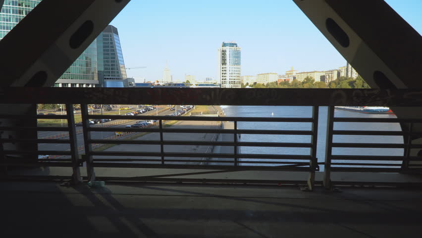 view of the city from inside the spatial structure of the steel bridge