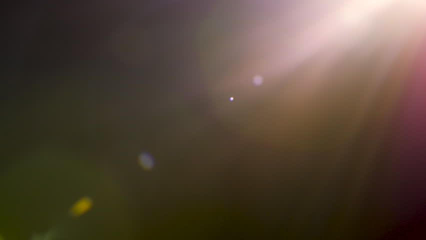 Beautiful abstract warm lens flares on black background. Perfect as overlay on your own footage | Shutterstock HD Video #1016401291