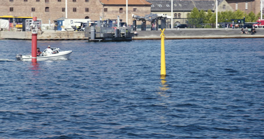Boat sailing in Copenhagen Harbor on a beautiful summer day