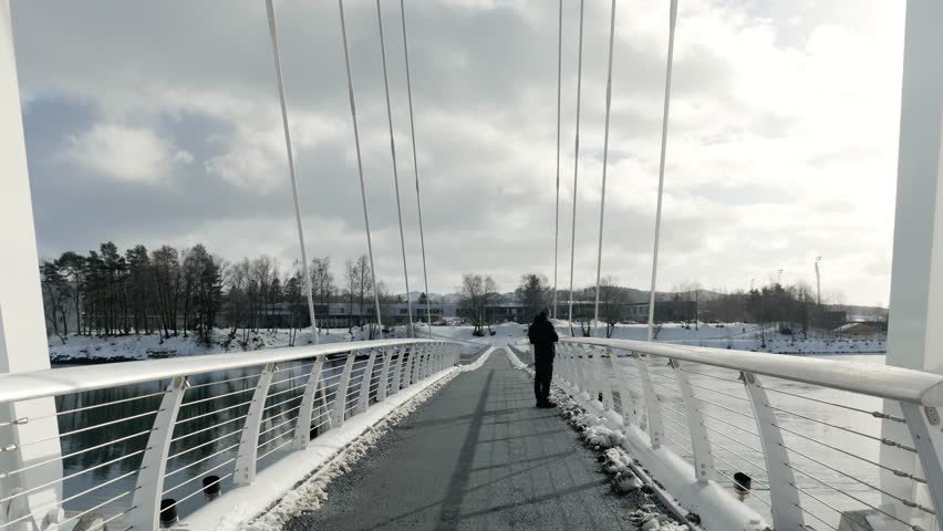 Snekkarberget bru in Levanger, Norway, standing man