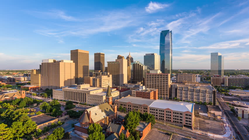 Oklahoma City, Oklahoma, USA downtown skyline from day to night.