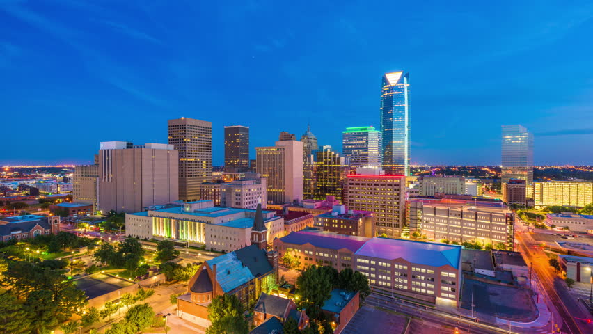 Oklahoma City, Oklahoma, USA downtown skyline from day to night.