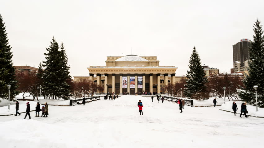 Novosibirsk, Russia. Novosibirsk Opera and Ballet Theater is popular place in Siberia, Russia. Its dome has a unique construction features. Beautiful design. Time-lapse during a cloudy winter day