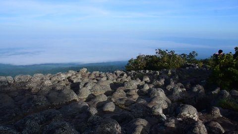 Cliffs.stone button.Cliff High.Wide view.Locations.Phu Hin Rong Kla National Park.Nakhon Thai District/Phitsanulok Province-Thailand.an unidentiedwomansells