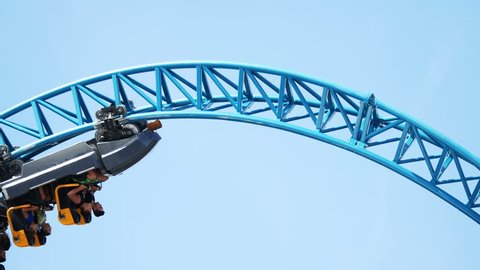 Rollercoaster upside down closeup against clear sky
