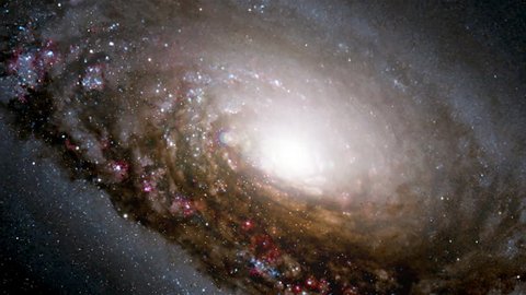 Travel into black eye galaxy rotating in outer space, bright brilliance light at center. Contains public domain image by NASA