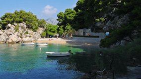 Romantic morning seascape of Adriatic sea. Colorful summer view of small beach in famous resort - Brela, Croatia, Europe. Beautiful world of Mediterranean countries. Full HD video (High Definition).