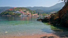 Sunny morning cityscape of Asos village on the west coast of the island of Cephalonia, Greece, Europe. Colorful spring sescape of Ionian Sea.  Full HD video (High Definition).