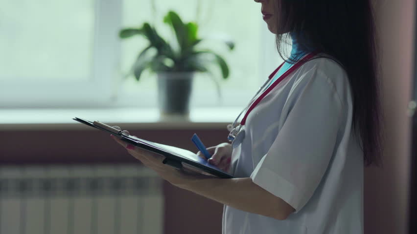 Woman doctor using tablet computer in hospital Royalty-Free Stock Footage #1016448892