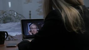 video conferencing with tutor. Young woman having online education at home. Distance education. 4K