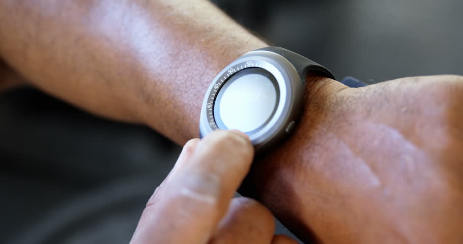 Close-up of man adjusting his smart watch 4k | Shutterstock HD Video #1016457544