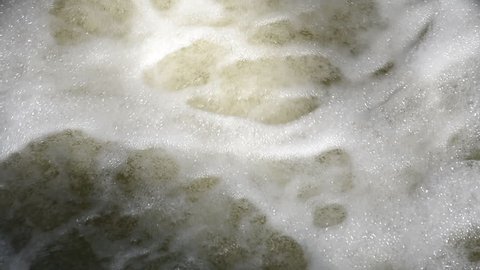dirty river water is like boiling, hd slow motion