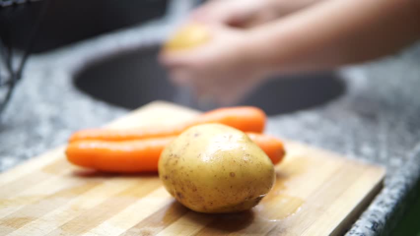 washing and cutting potatoes vegetables