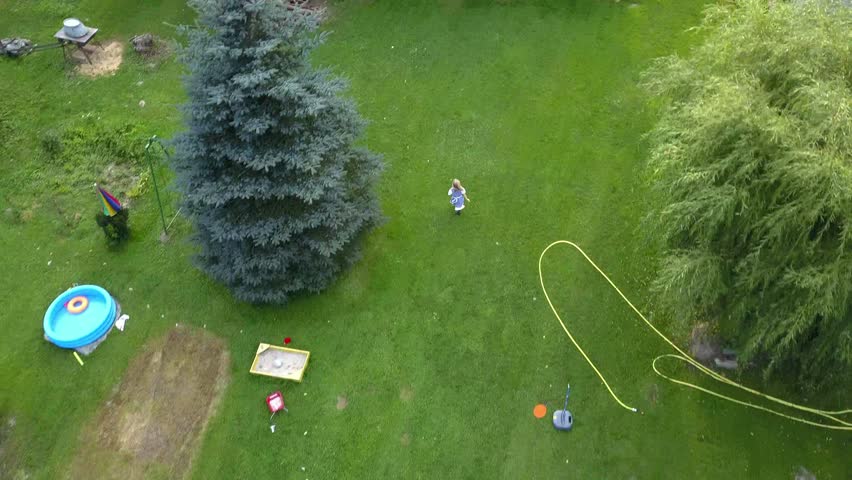 Young Girl Running Into a Barn