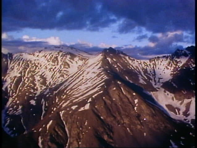 BROOKS RANGE, ALASKA, 1989, Aerial trip, POV, midnight in June, orangey