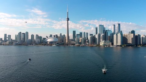 Aerial view of Toronto skyline including architectural landmark CN Tower on a sunny day in Toronto, Ontario, Canada.
