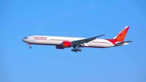 NEW YORK - 2018: Air India Boeing 777-300 Commercial Jet Airplane on Final Approach Airplane into JFK International Airport on a Sunny Day with a Blue Sky Background