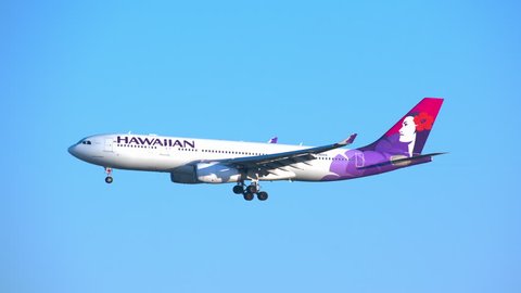 NEW YORK - 2018: Hawaiian Airlines Airbus A330-200 Commercial Jet Airplane on Final Approach into JFK Airport on a Sunny Day with a Blue Sky Background