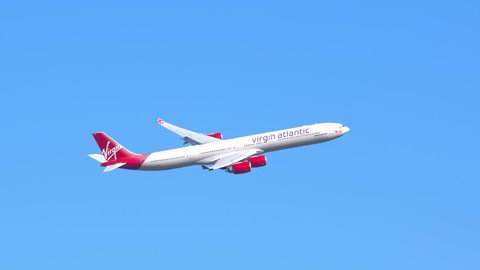 NEW YORK - 2018: Virgin Atlantic Airways Airbus A340-600 Commercial Jet Airplane Flying in a Clear Blue Sky after Taking Off from JFK International Airport