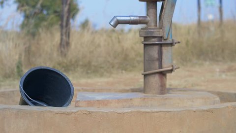 Static Shot of a Well and an Empty Bucket in Africa