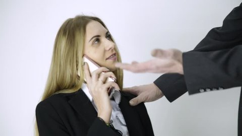 employee is talking on a phone, boss snatches her phone and starts to swear. Careless employees and conflicts at work