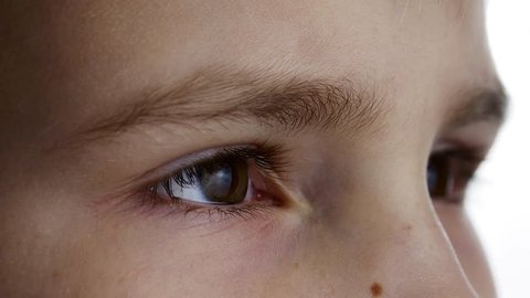 Kids eye close-up on the white background. shot in Ultra HD 4k