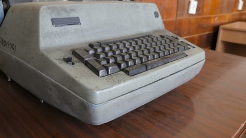 The dirty, dusty typewriter. Angle shot of the retro typewriter machine
