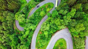 Aerial View landscape serpentine road winding on the mountains background in summer sunny day, Drone 4K Video