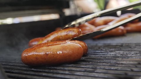 bratwurst grilling barbequing close up in the nature stock video