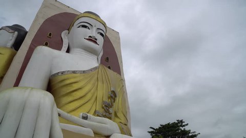 BAGO,MYANMAR - AUGUST 19,2018 : Four Faces of Buddha at Kyaikpun Buddha, in Bago, Myanmar, in the rainy season
