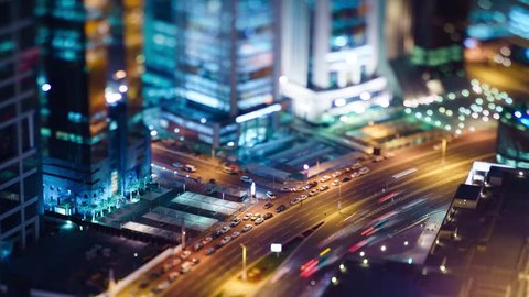 High angle view of traffic during the night in West Bay, Doha, Qatar. Miniature tilt-shift effect.